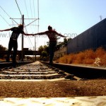 holding hands on the tracks